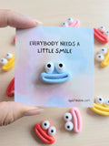 000 ($7) Uplifted Ink - Mini Smile Card with Figurine