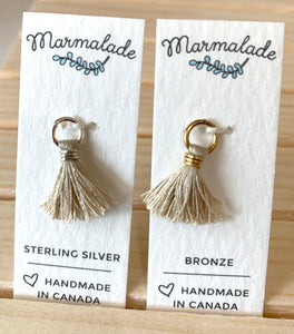 071 ($5) Marmalade - Tassel Charm - Silver